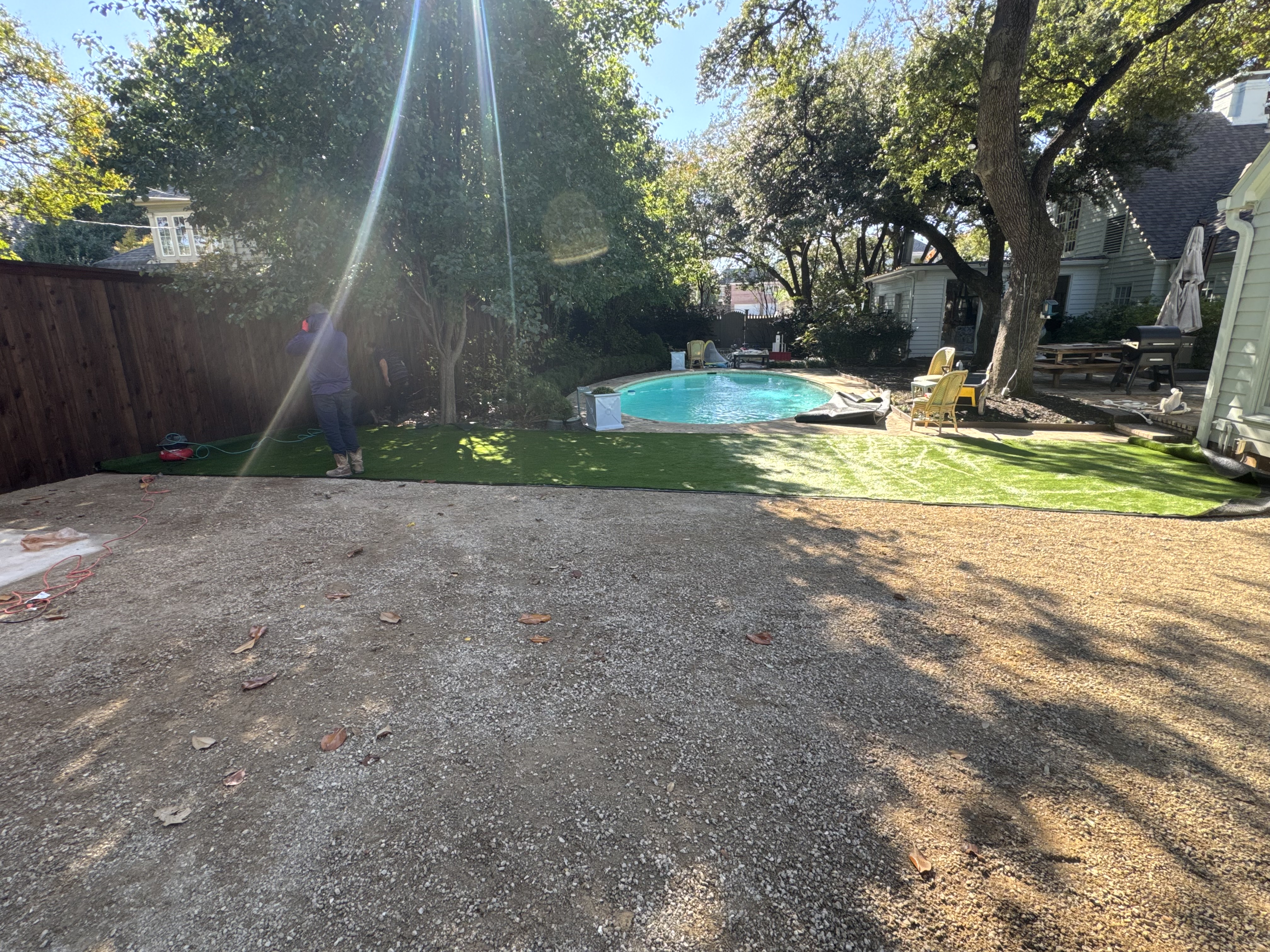 Artificial turf installation in Highland Park backyard